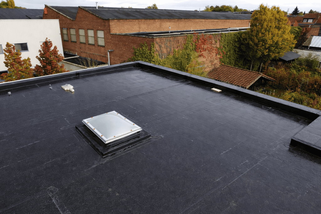 Commercial flat roof installation by Legacy Contractor in Orange County NJ providing waterproof protection for industrial buildings.