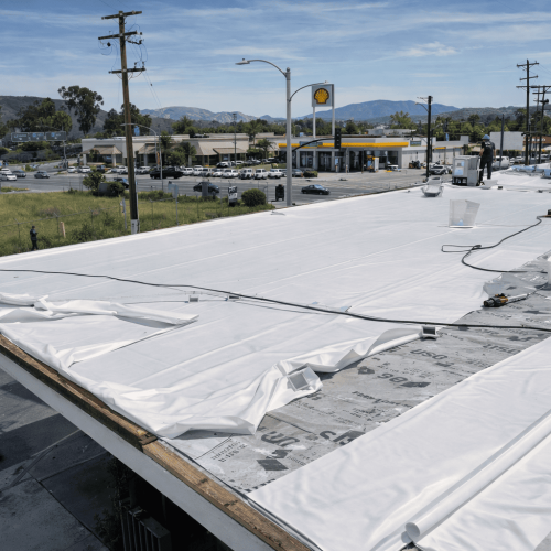 Commercial flat roof membrane installation by Legacy Contractor in Orange County NJ on a retail building.