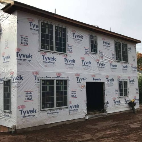 New home construction in progress with Tyvek wrap installed by Legacy Contractor in Orange County NJ