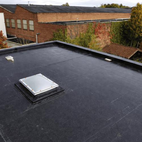 Commercial flat roof installation by Legacy Contractor in Orange County NJ providing waterproof protection for industrial buildings.