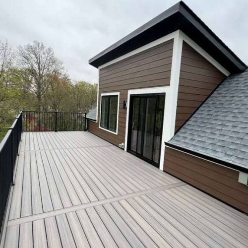 Rear Exterior Roofing and Siding Installation with Elevated Deck